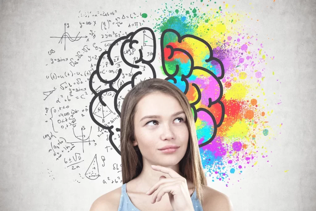 Girl thinking in front of brain diagram.