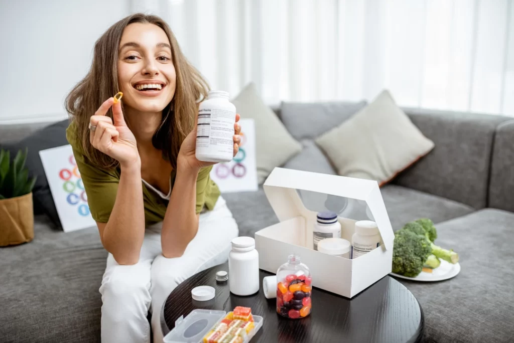 Woman with nutritional supplements for the treatment of ADHD burnout.