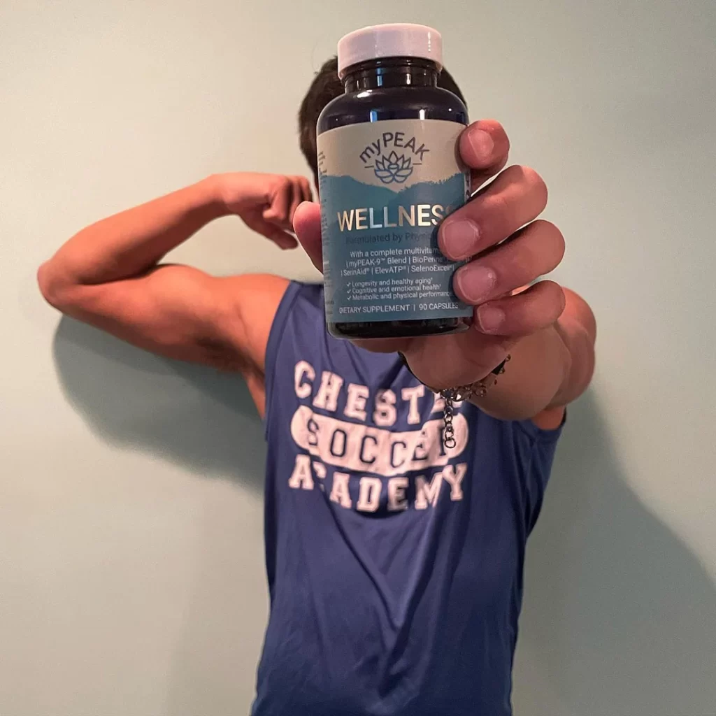 Young Boy holding My Peak Supplements.