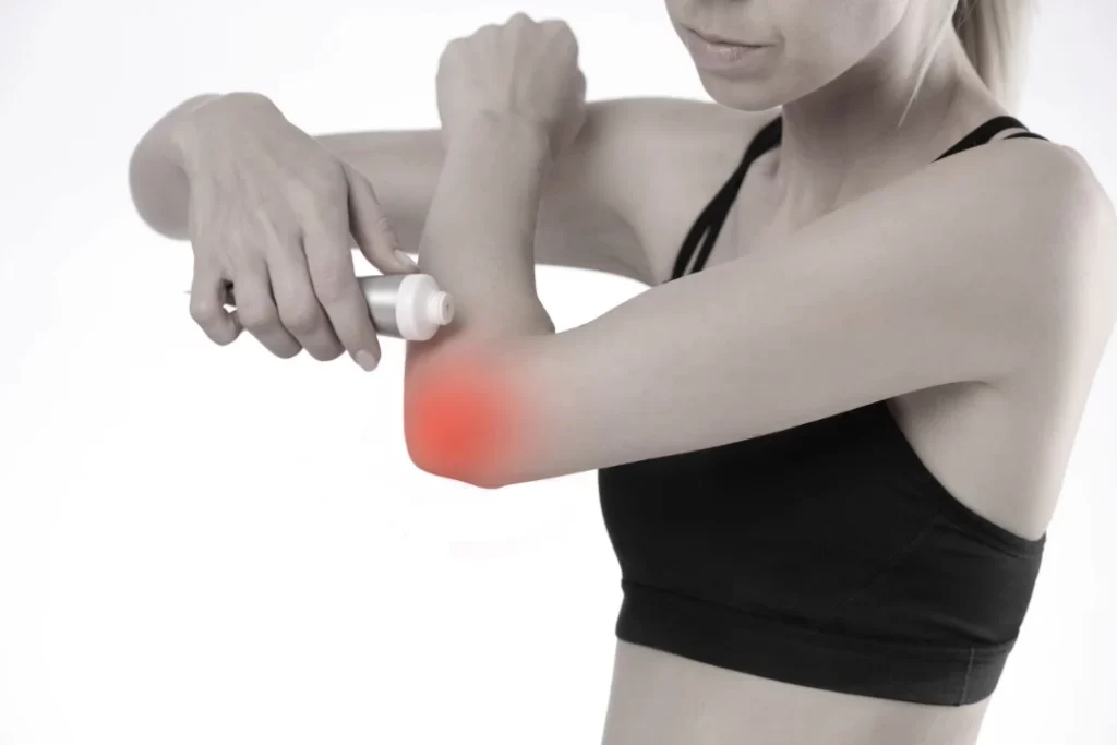 woman applying Medterra pain cream on her elbow. 