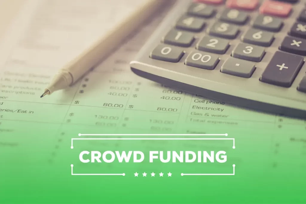 Crowd Funding and finance with calculator and pen a side.