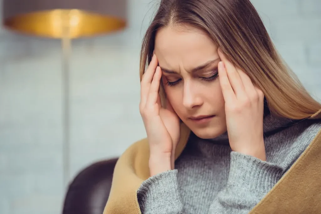 A lady facing headache.