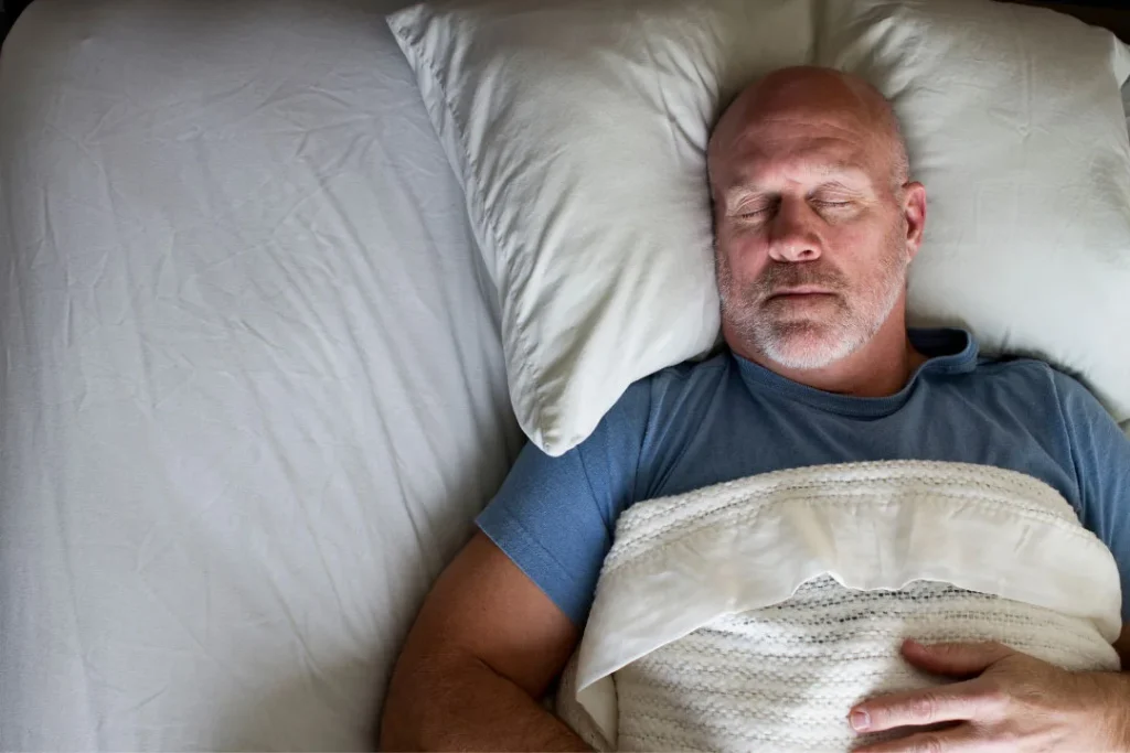An old man enjoying a healthy sleep. 
