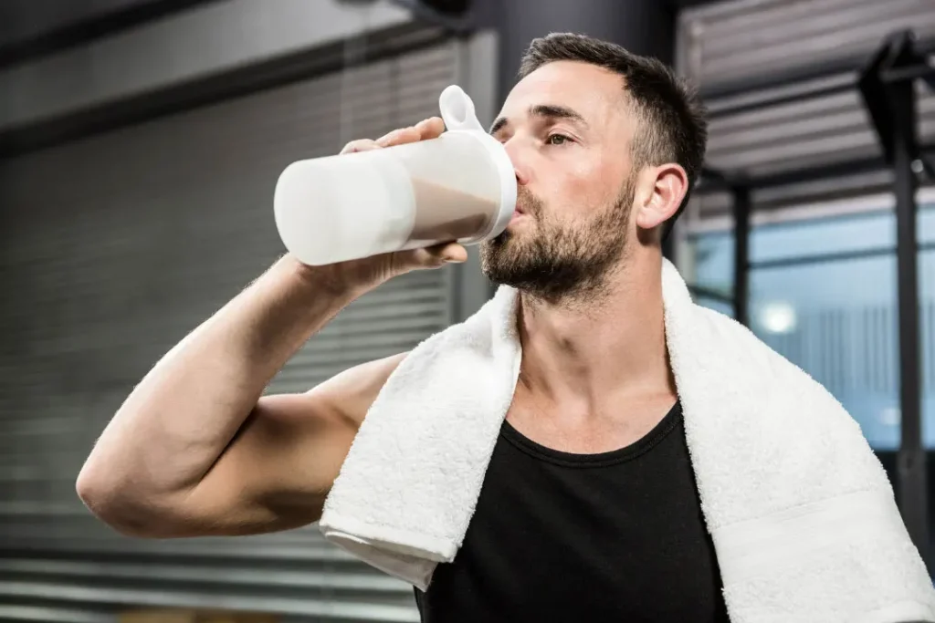 A man enjoying the protein powder shake. 