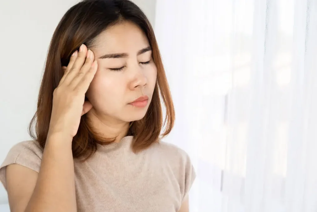 A lady having headache.